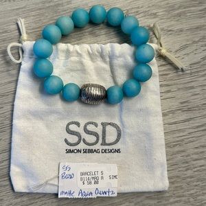 Matte aqua quartz stretch bracelet with original price tag and jewelry bag